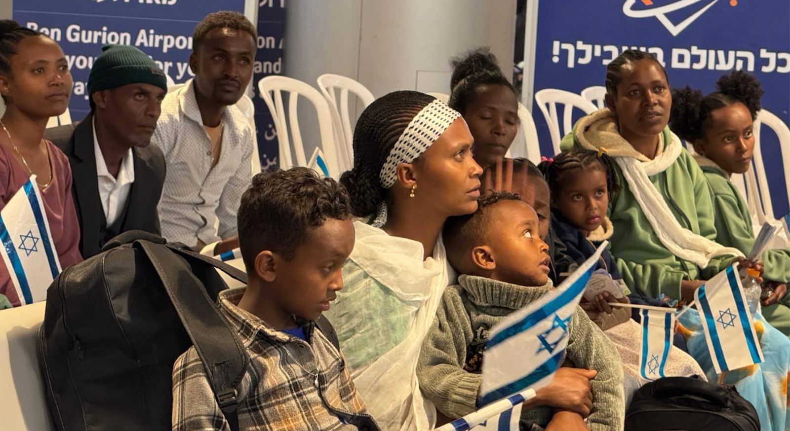 Ethiopian and diverse Jewish groups with Israeli flags